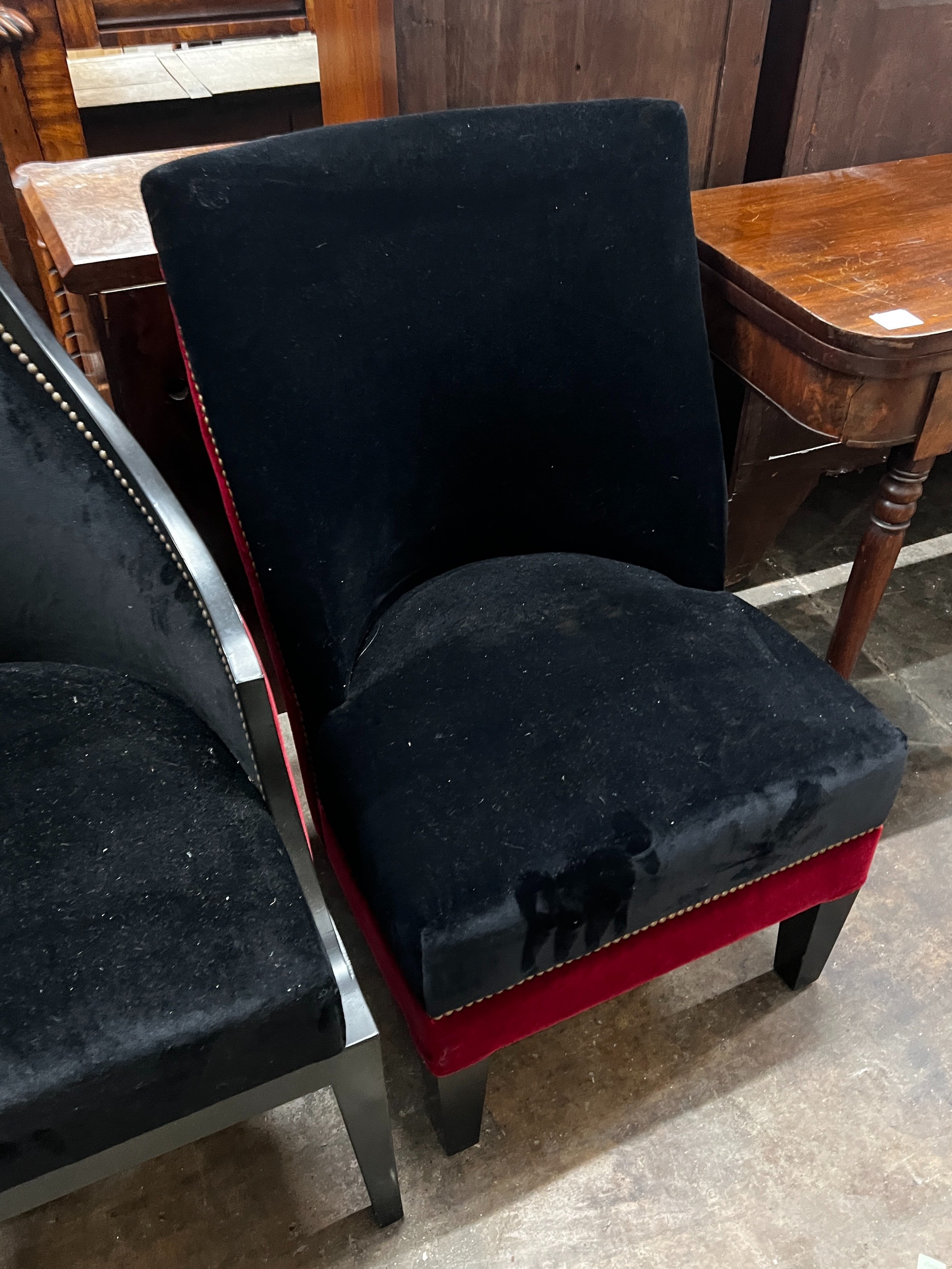 Two upholstered ebonised side chairs, larger height 94cm